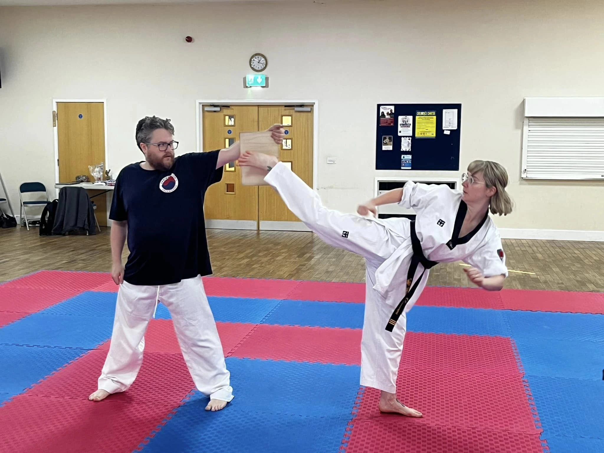 Student demonstrating powerful high kick at Springwater Taekwondo Sheffield S12